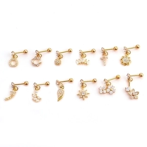 Set of 12 gold stainless steel ear studs with various zircon charms like stars and crosses