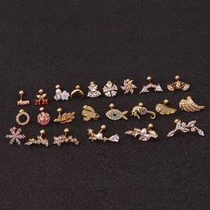 Various rose gold stainless steel screw back earrings with sparkling zircons on black background