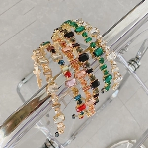 Macro view of crystal headbands with multi-color rhinestones on a display stand
