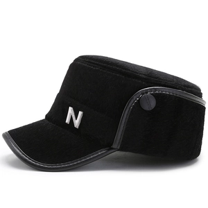 Winter black faux fur flat top cadet hat for elderly men with silver metal N logo detail
