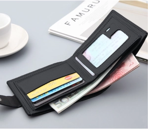 Detail view of black leather bifold wallet with multiple card slots and an ID window