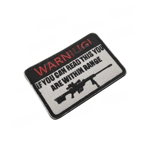 Detailed embroidery of Warning tactical patch with rifle silhouette and border stitching