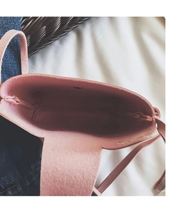Detailed interior view of pink girl's cat crossbody bag showing single compartment