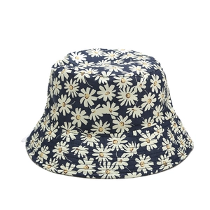 Reversible navy blue bucket hat with small daisy floral print for outdoor sun protection