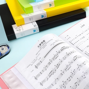 Macro shot of colorful A4 display books showing transparent inner pockets and spine labels