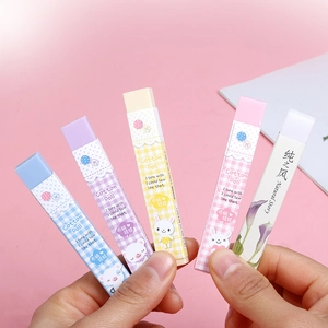 Five assorted colorful rectangular erasers with cute animal and floral patterns in hand