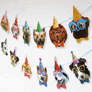 Detailed view of cartoon dog breed paper banners with birthday hats on brick wall