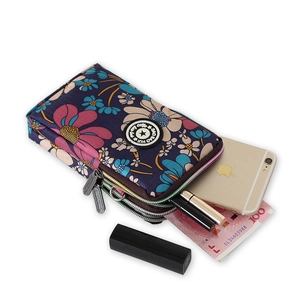 Floral mini crossbody phone bag with three zipper compartments in dark blue and pink