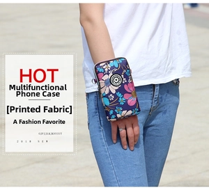 Floral print arm bag for phone featuring metallic zippers and branded circular logo