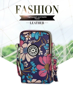 Compact purple floral crossbody phone pouch with adjustable strap and silver zipper closure