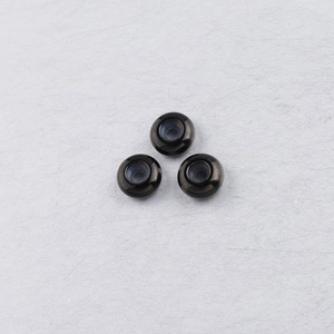 Macro detail of 8mm stainless steel positioning beads with inner rubber rings for DIY jewelry