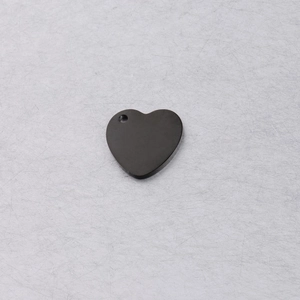 Macro shot of 15mm black polished heart pendant charm with pre-drilled hanging hole