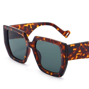 Retro oversized square tortoiseshell sunglasses with dark lenses and thick frames