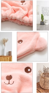 Detailed view of pink coral fleece bear hair towel with soft texture and embroidery