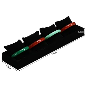 Black velvet single-row jewelry display tray with four pillows for watches and bracelets