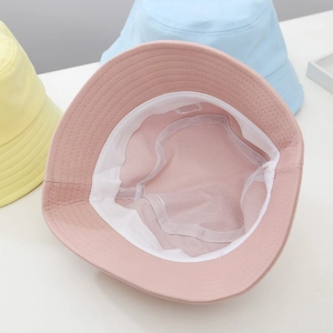 Kids smiley bucket hats in pastel pink, yellow, and blue colors for sun protection