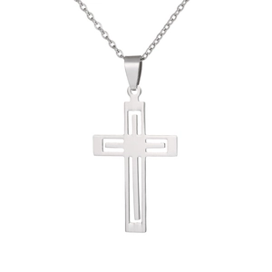 Macro shot of silver hollow-out cross pendant with polished stainless steel geometric layers