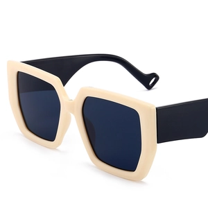 Retro oversized geometric cream beige sunglasses with black lenses on white background
