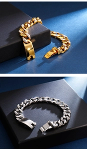 Macro shot of gold and silver 18K plated stainless steel Cuban links with side diamonds