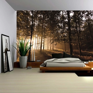 Detail of Nordic forest sunrise tapestry hanging over a modern bed in a cozy bedroom