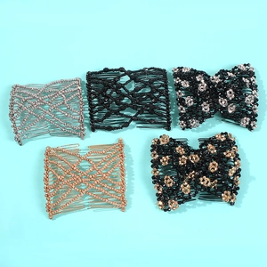 Flat lay view of 5 assorted beaded magic hair combs in silver, black, and rose gold