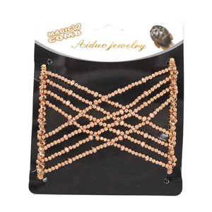 Detail of rose gold magic hair comb with elastic beads on branded packaging card