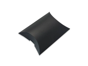 Close-up of a minimalist black pillow-shaped gift box on a clean white background
