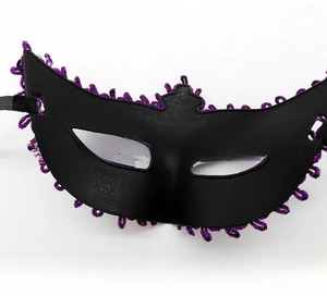 Detail of black masquerade mask with purple sequin trim and elastic strap closure