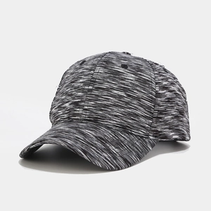 Close-up of black and white tie-dye baseball cap fabric and reinforced curved brim