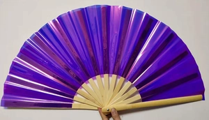 Macro detail of a 33cm purple laser holographic kung fu fan with natural bamboo ribs