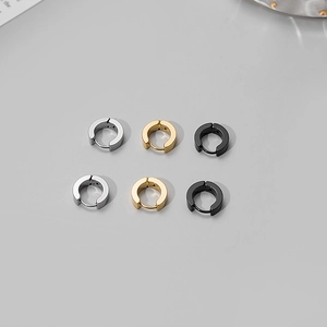 Three pairs of stainless steel hoop earrings in silver, gold, and black colors