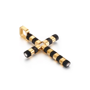 Classic stainless steel cross pendant in black and gold finish on white background