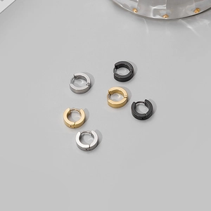 Three pairs of stainless steel round hoop earrings in silver, gold, and black colors