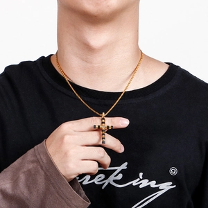 Men's classic gold and black stainless steel cross necklace worn by model