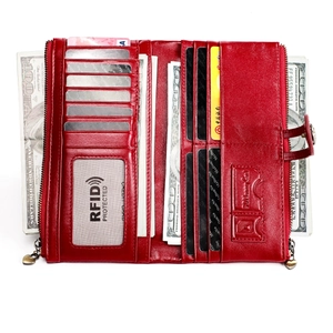 Detail of red leather long wallet interior showing multiple card slots and RFID protection