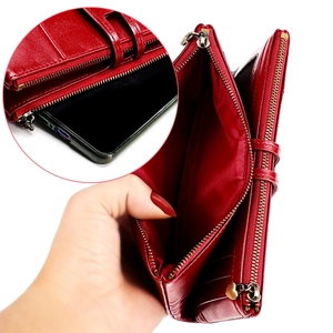 Detail of red RFID leather wallet interior showing card slots and smartphone compartment