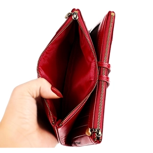 Internal view of red leather RFID long wallet showing multiple card slots and dual zippers