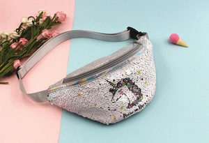 Detail of silver sequin waist bag featuring a colorful unicorn design and adjustable strap