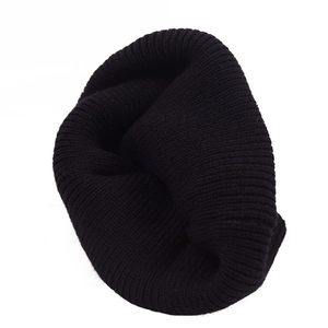 Detailed view of the black ribbed knit texture on this warm winter beanie for kids