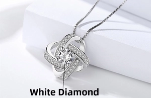 Detailed macro of S925 sterling silver spinning clover necklace with shiny cubic zirconia