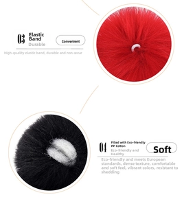 Detail of red and black faux rabbit fur balls with elastic bands and soft PP cotton