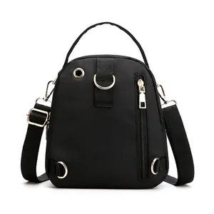 Water-resistant black nylon backpack with gold zippers and multi-pocket functional design