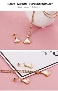 Détail de l'ensemble collier et boucles d'oreilles en forme d'éventail avec nacre et chiffres romains