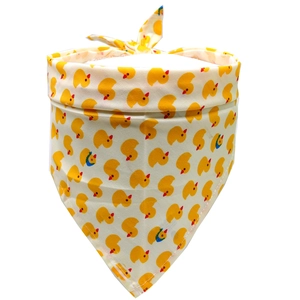 Detail of cream cotton dog bandana featuring cute yellow duck patterns and neat stitching