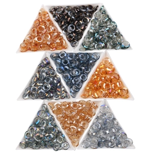 Assorted circular glass nail art beads in diverse colors arranged in triangular trays