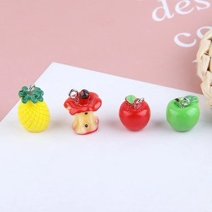 Colorful DIY resin fruit charms including pineapple and apples with metal rings