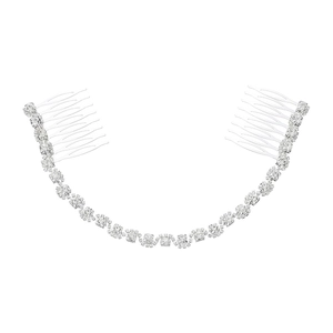 Close-up of silver bridal hair comb with shimmering rhinestones and elegant curved design