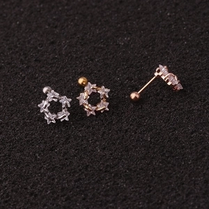 Three dainty star-shaped zircon stud earrings in silver gold and rose gold finishes