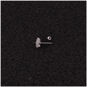 Cute zircon flower earring in stainless steel with crystal accents on black background