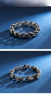 Detail of heavy industrial steel bracelet with lion embossing and sturdy clasp
